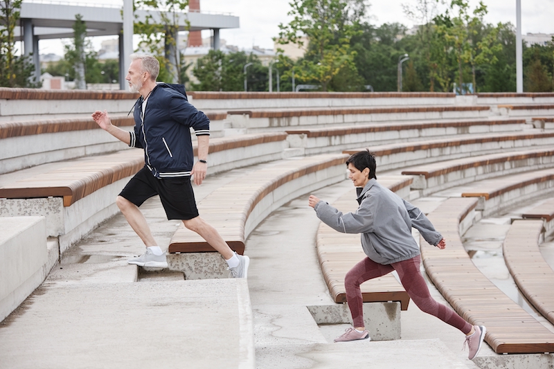 A couple is running up some stairs for exercise, which is the best way to lose weight in OKC.