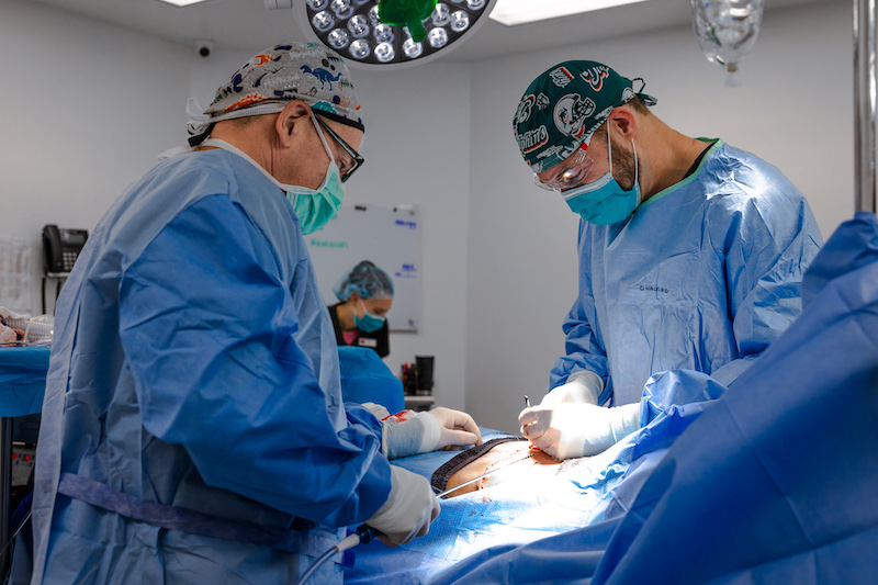 Two surgeons at Cosmetic Surgery Affiliates are performing excess skin removal in Jacksonville.